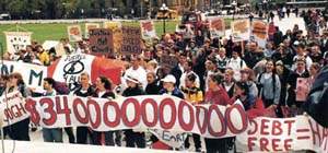 Catholic high school students on Parliament Hill, Ottawa. Debt total is CDN $340 billion.  Credit: Sara Stratton/Canadian Ecumenical Jubilee Initiative