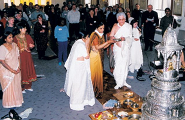 Members of the temple conduct a Jain prayer service which is known as Snatra-Astaprakari Puja.