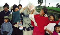 'They got me!' The people of La Pradera community welcome Scarboro missioner Anne Quesnelle to their carnival celebrations. 'Playing' carnival includes getting doused with eggs and flour.