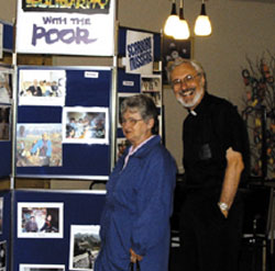 Elizabeth Rozes welcomes Scarboro missioner Fr. Roger Brennan during his visit to St. Stephen's parish, Stephenville, Newfoundland.