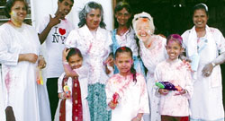 Scarboro missioner Kate O'Donnell and friends in the community take part in the springtime Hindu festival of Phagwah.  People joyfully throw coloured water and sweet perfumes on one another ot match the scenic beauty, colour and fragrances of the season.