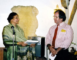 Talat Muinnidin, Muslim representative of the National Muslim-Christian Liaison Committee, presents an interfaith award to Paul McKenna of the Scarboro Missions Interfaith Desk.