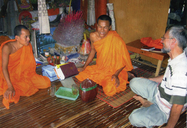 Buddhist monks in dialogue with Fr. Gerald Vogin of the Paris Foreign Mission Society and Vicar General of the diocese
 of Kompong Cham, Cambodia.