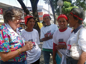 Sr. Mary Gauthier with some of the farmers who are protesting the aerial spraying of banana trees since the spray harms the workers as well as the earth. For two months they have camped on the sidewalk in front of the court of appeal waiting for a decision even as they hold prayer vigils and Eucharistic celebrations to keep alive their trust in God.