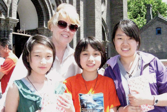 Dana with Heidi (left), Lucia, and Simona, three of the eight students she prepared for Confirmation at Sacred Heart Church (photo left). Heidi has musical talent, Lucia is almost fully bilingual and studies the Bible at home every day, and Simona is a high school student who hopes to study in Australia or North America one day. All three on this day received the Sacrament of Confirmation.