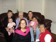 (Credit: Cheyanne Childforever) At Nazareth House in Toronto. Seated L-R: Crystal and baby, Sr. June Dwyer of the Sisters of St. Joseph, and Michelle and baby. Front L-R: Suzana and Sr. Norma Samar.