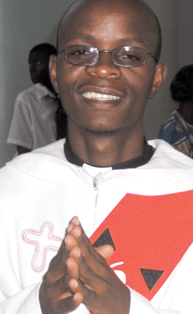 Edmond’s parents accompany him at the ceremony. Photos by Mary Olenick.
