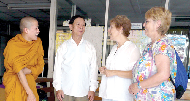 R-L: Scarboro lay missioners Mary Olenick and Susan Keays with Mr. Hsai, director of the Migrant Centre where Susan teaches, and a Buddhist monk who studies at the Centre. Mary coordinates Scarboro’s Lay Mission Office in Canada and was on visitation.
