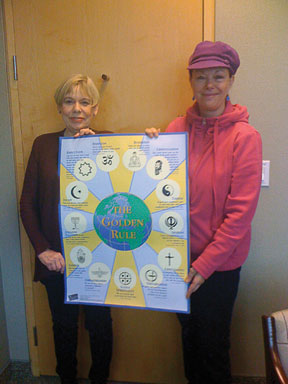 On behalf of Scarboro Missions, Tina Petrova presents Karen Armstrong with a Golden Rule poster and introduces her to Scarboro's wealth of Golden Rule materials during Karen's recent visit to Toronto.