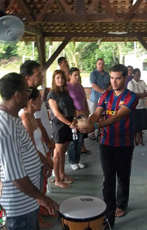 CIMI participants offer a prayer with sacred purifying smoke.