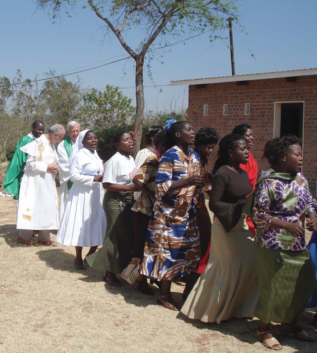 (Credit: Scarboro Missions)
During a visit to Scarboro’s mission team in Mzuzu, Malawi, Fr. Jack Lynch concelebrates Mass, with the women leading the opening procession.

