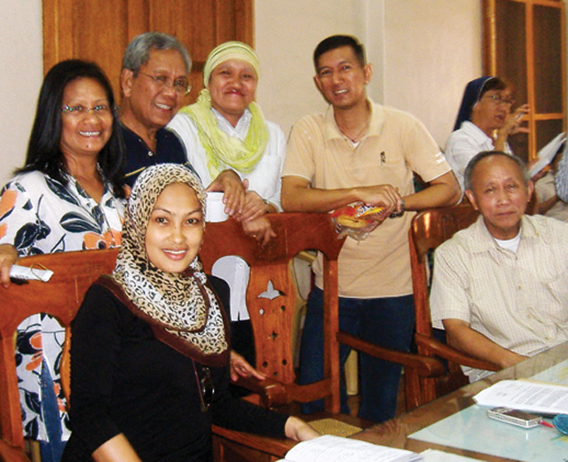 Muslim and Christian community leaders in Cagayan de Oro meet once a month to share friendship and a meal. Standing L-R: Lorie; Monsignor Rey Monsanto, Vicar General of Cagayan de Oro; Amina Mambuay; Fr. Noel Ponsavan. Seated: Leah Mehila and Antonio Ledesma SJ, Archbishop of Cagayan de Oro.