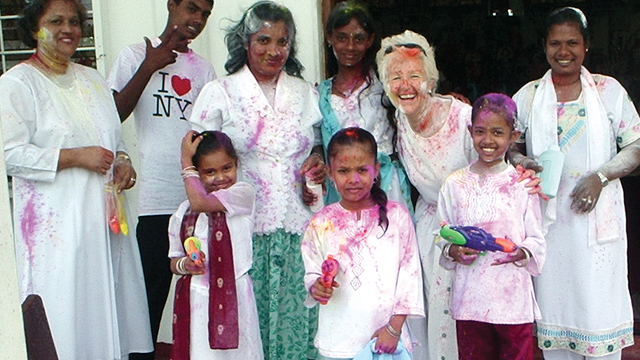 Scarboro missioner Kate O’Donnell and her neighbours in Guyana are covered in coloured powder as part of the celebrations for Phagwah (or Holi), the Festival of Colours, a Hindu religious holiday. Encountering other religions is part of Scarboro’s missionary work in Guyana with its intermingling of peoples of Christian, Muslim, and Hindu faith traditions.