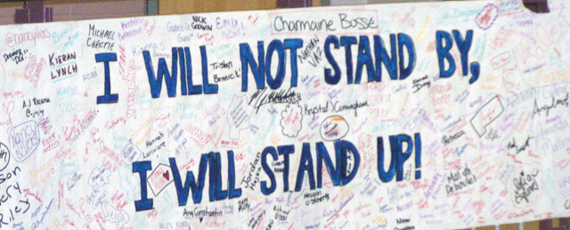 Banner, signed by students, hanging in the foyer of the school.