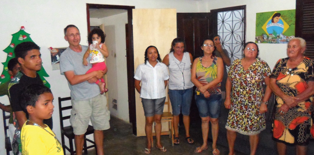 In Pici, Brazil, Bernardo Rosemeyer (holding a child) and friends gather for a Christmas party, keeping alive this OLM Christmas tradition much loved by the community. Photo by Francisco Fernando.