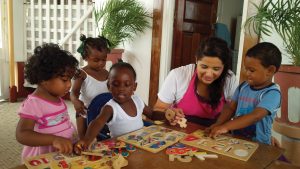 Paulina Gallego with some of the children at the daycare where she worked in Georgetown, Guyana.