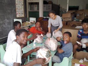 Scarboro lay missioner Donna Tai making papier mâché piñatas with students at the St. John Bosco Academy, a school for orphaned boys in Georgetown, Guyana. Donna’s ministries include the orphanage, catechesis, and bringing music and friendship to the elderly and shut-ins. She hopes to begin working with victims of human trafficking, an initiative of the Sisters of Mercy.