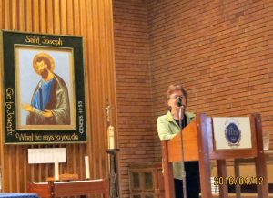 Sr. Lucy Thorson, nds, the organizer of this Panel Discussion, begins the evening