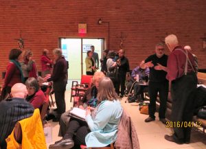 Partial view of large turnout in the chapel of Regis College