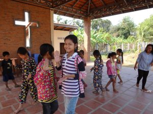Children in the small Catholic community of Kdol Leu performing a Khmer dance. Cambodia